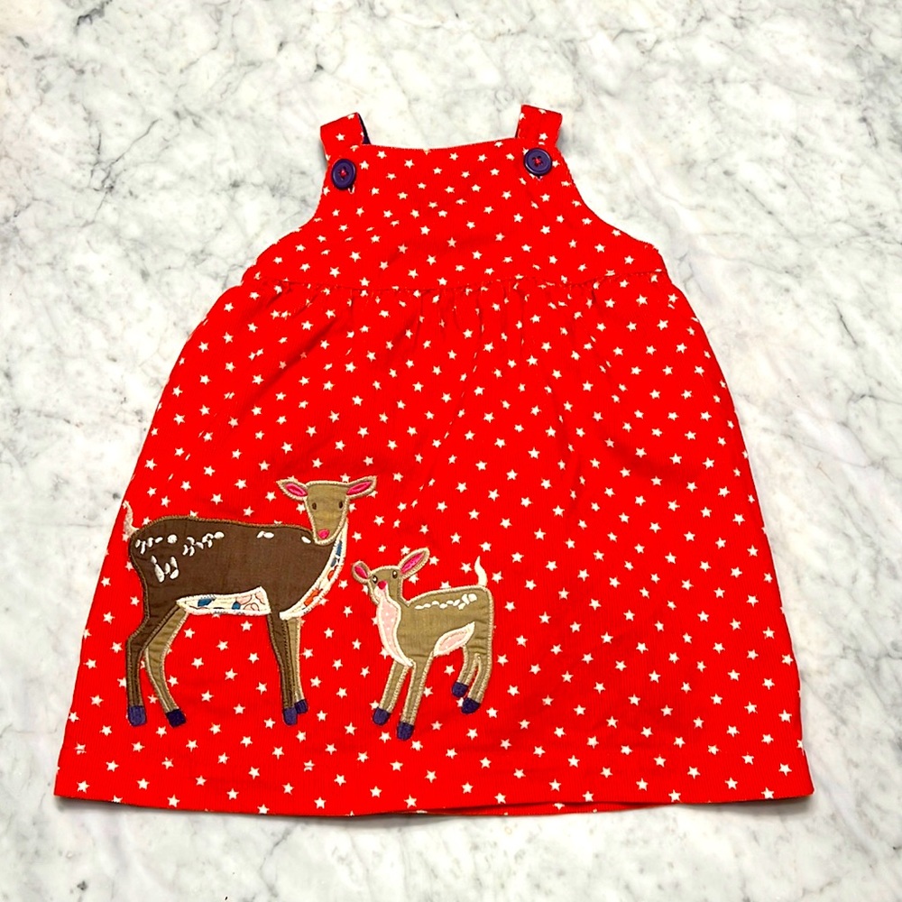 Baby Boden corduroy dress with deer and star background